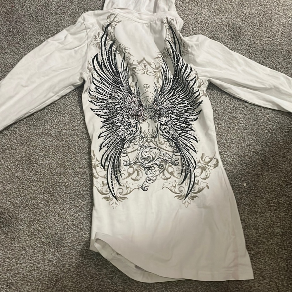 Sweater, rhinestones and wing looking print on both sides and arms